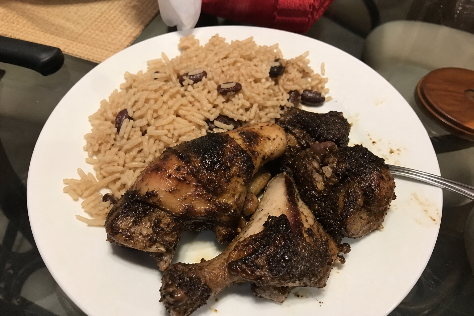 Caribbean style plated meal with chicken and rice